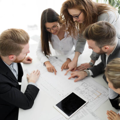 Business people and architects collaborating on project