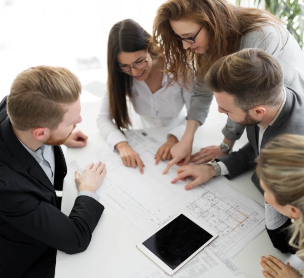 Business people and architects collaborating on business project